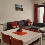 The lounge area at Bungalow No 31 includes a sofa bed